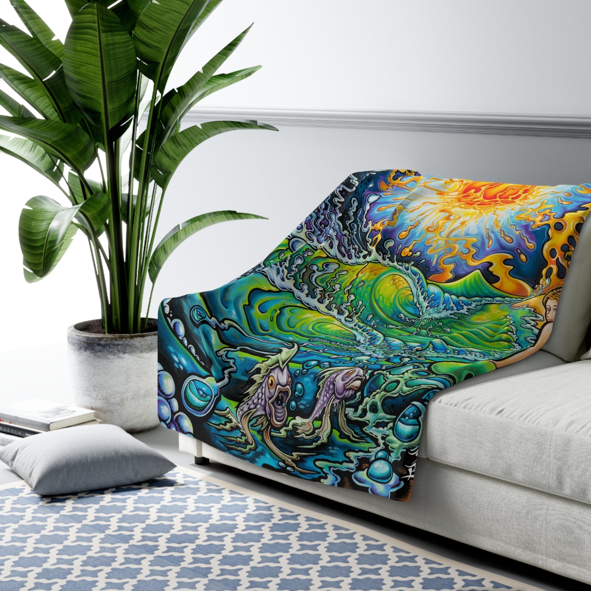 Colorful abstract design blanket draped over a sofa in a living room setting.